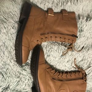 Tan buckled booties.